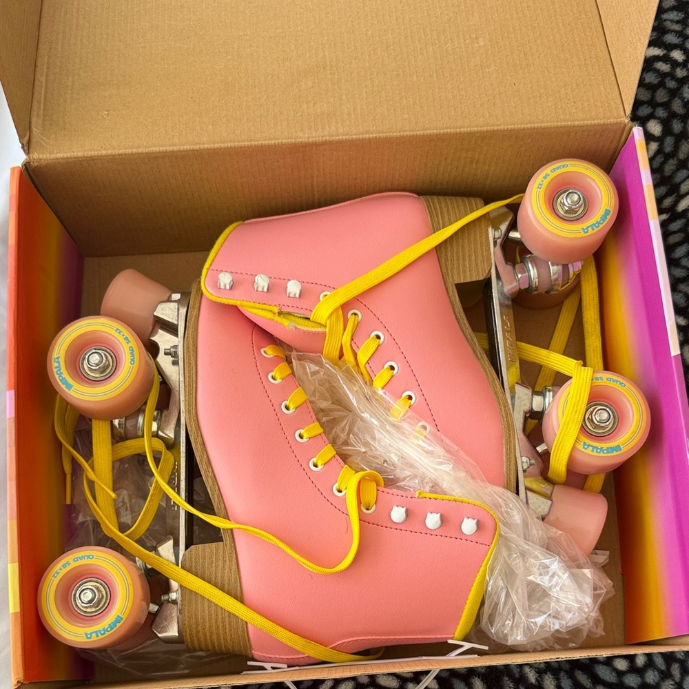 Vibrant Pink Roller Skates with Yellow Laces